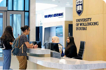 International students at university reception desk in Dubai